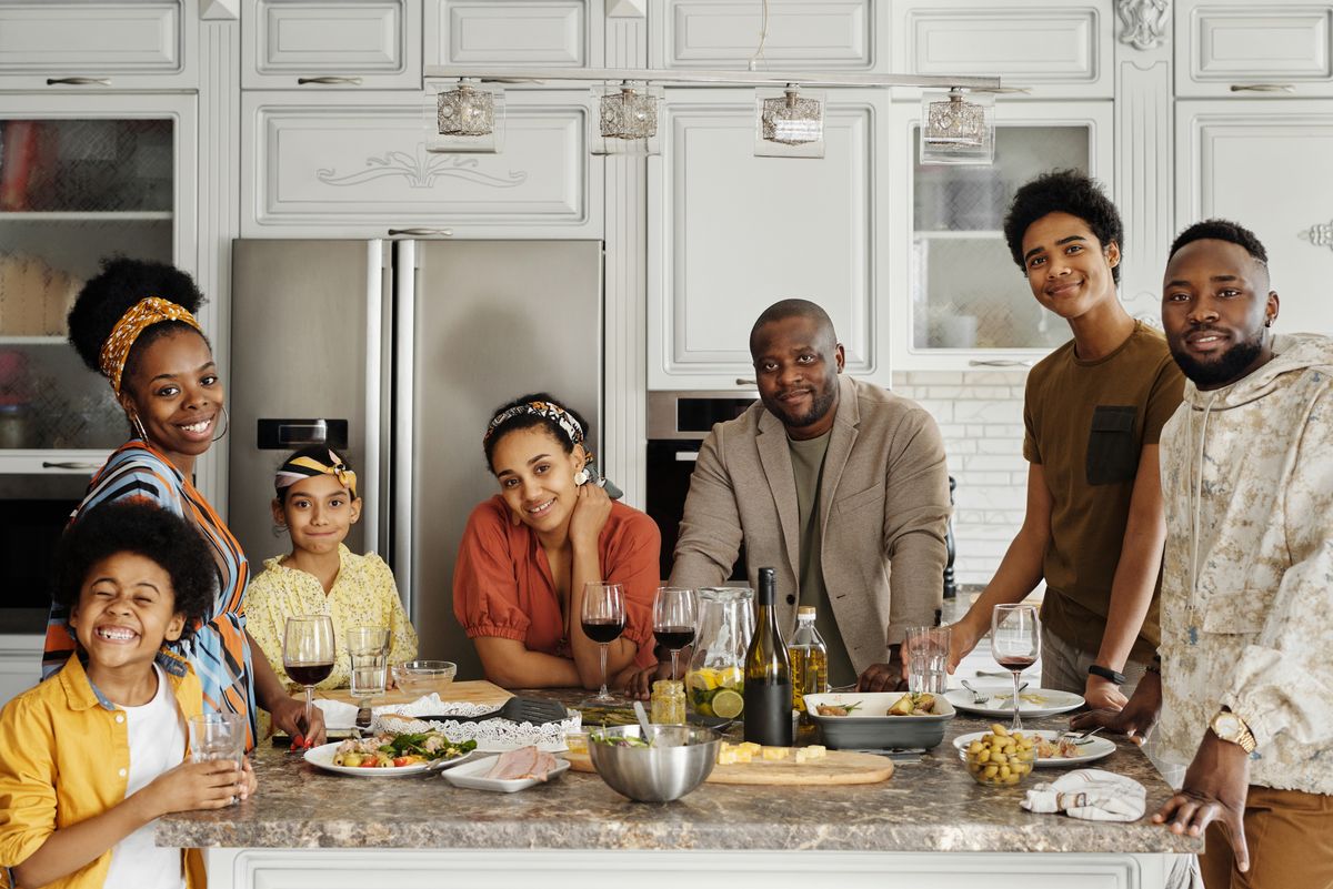 Family enjoying dinner together in a bright, clean kitchen