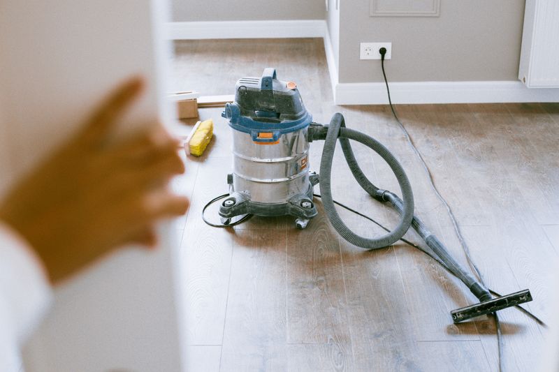 Cleaning equipment set up on a hardwood floor